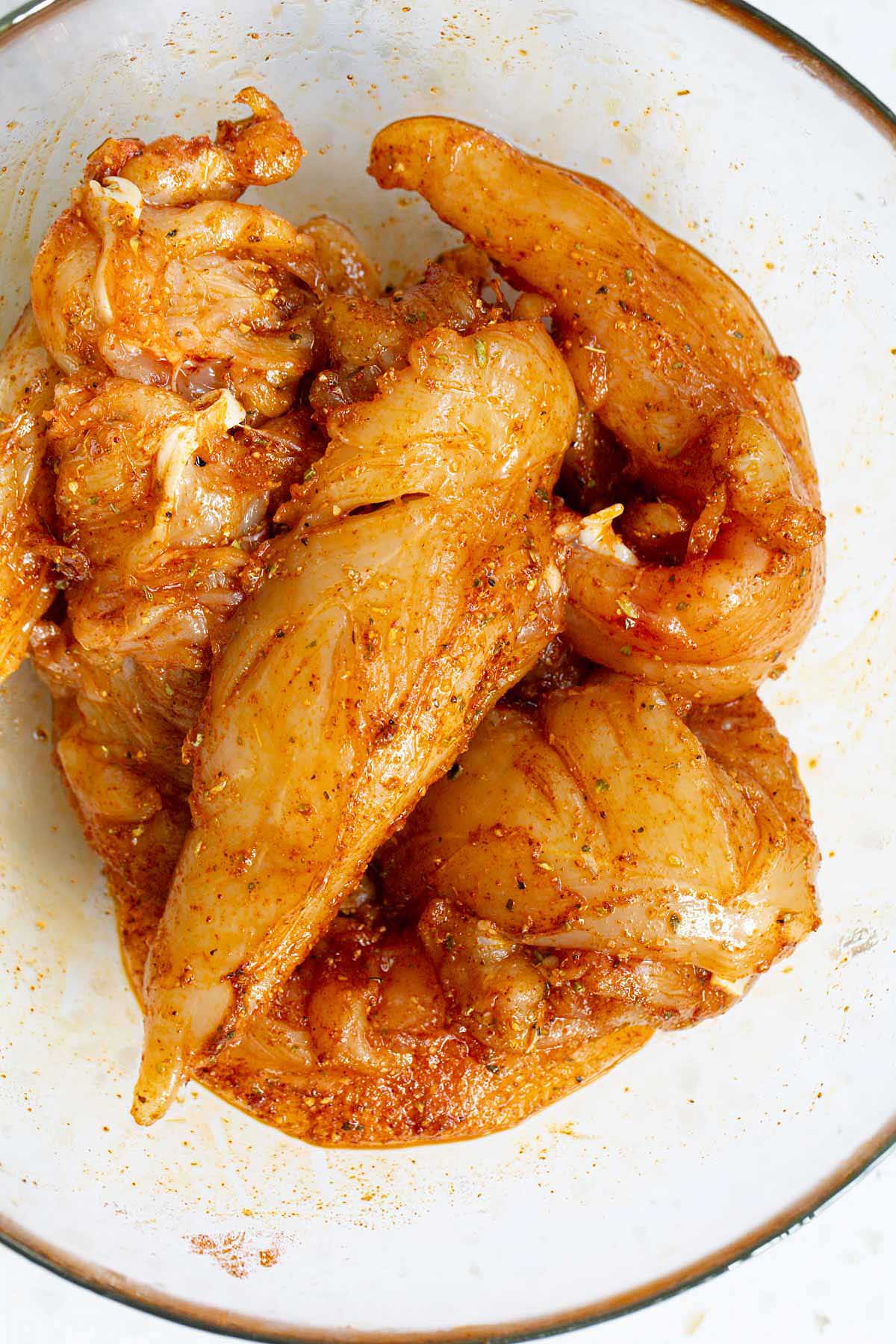 Chicken tenders mixed with oil and seasonings