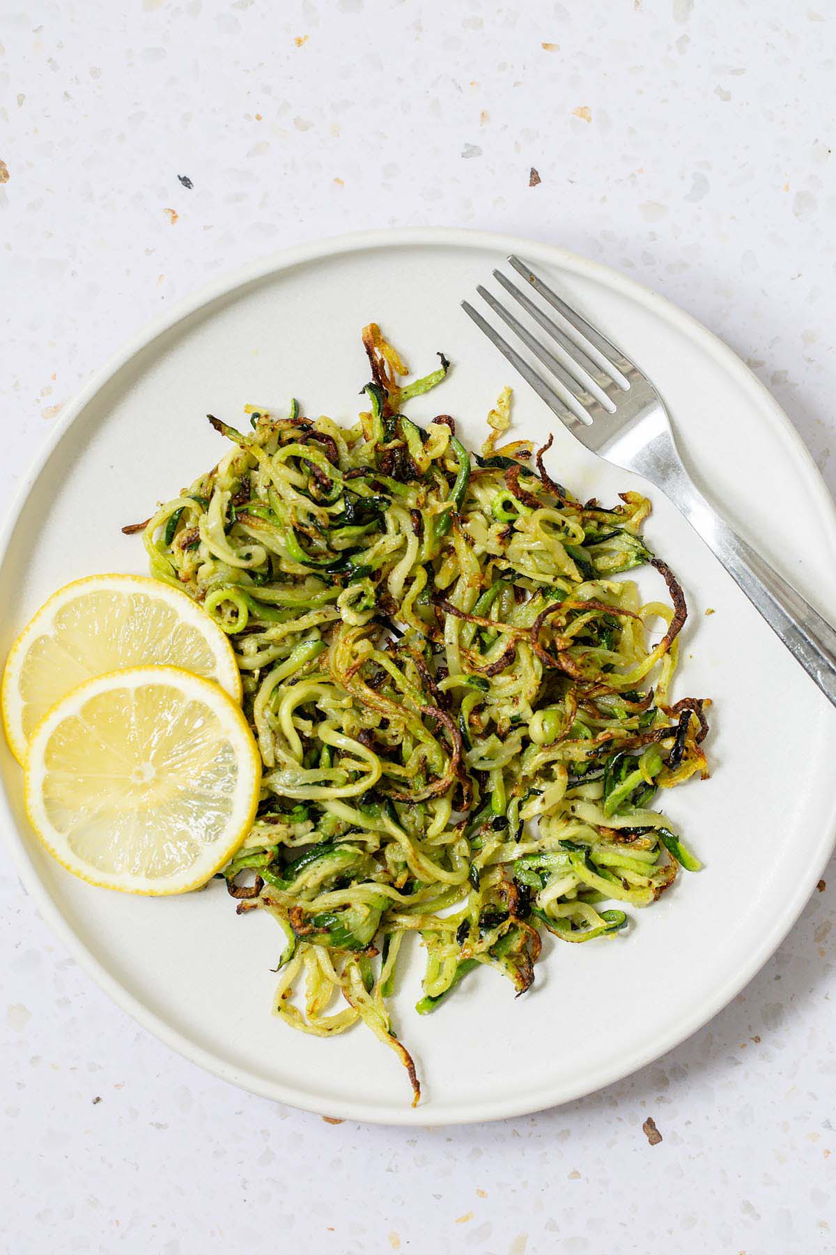 air fryer zoodles on a white plate