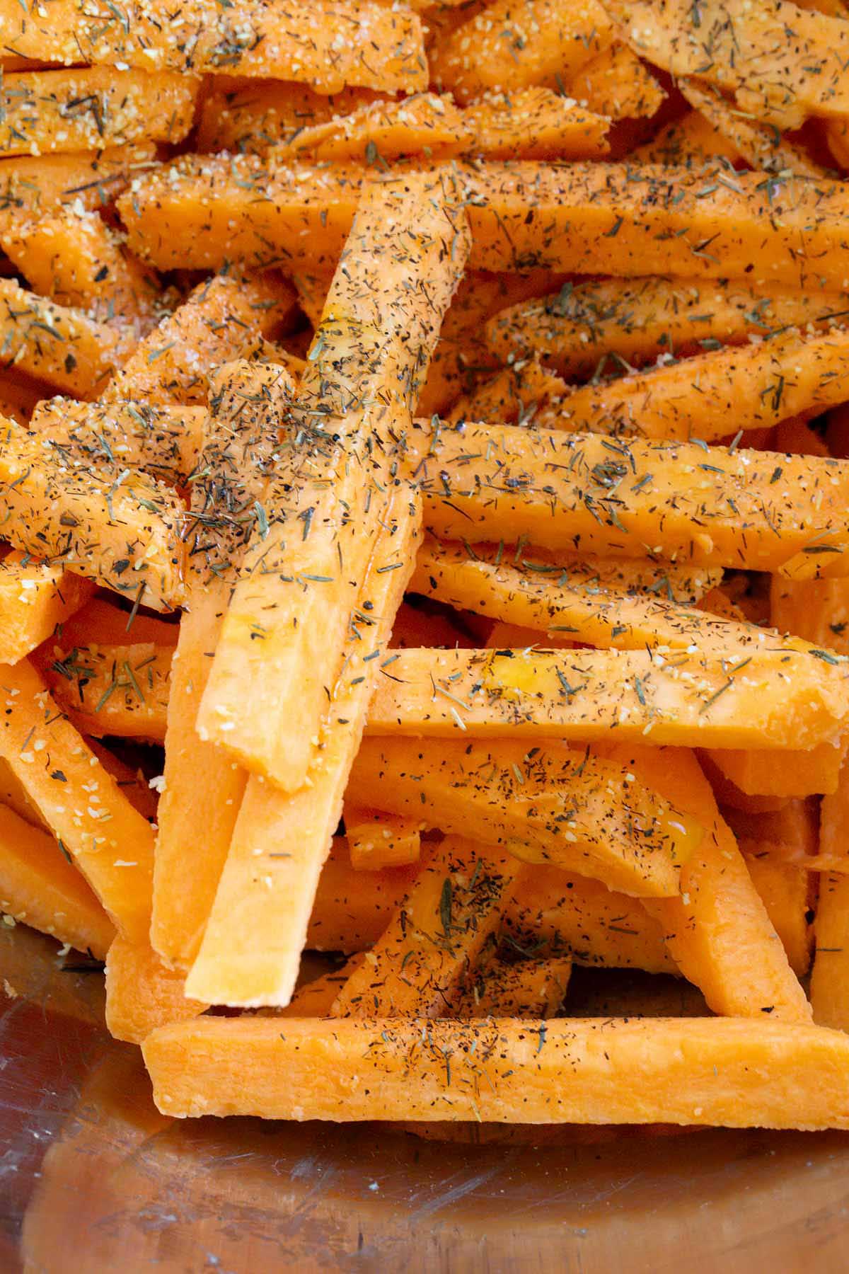 Raw sweet potato fries with seasonings