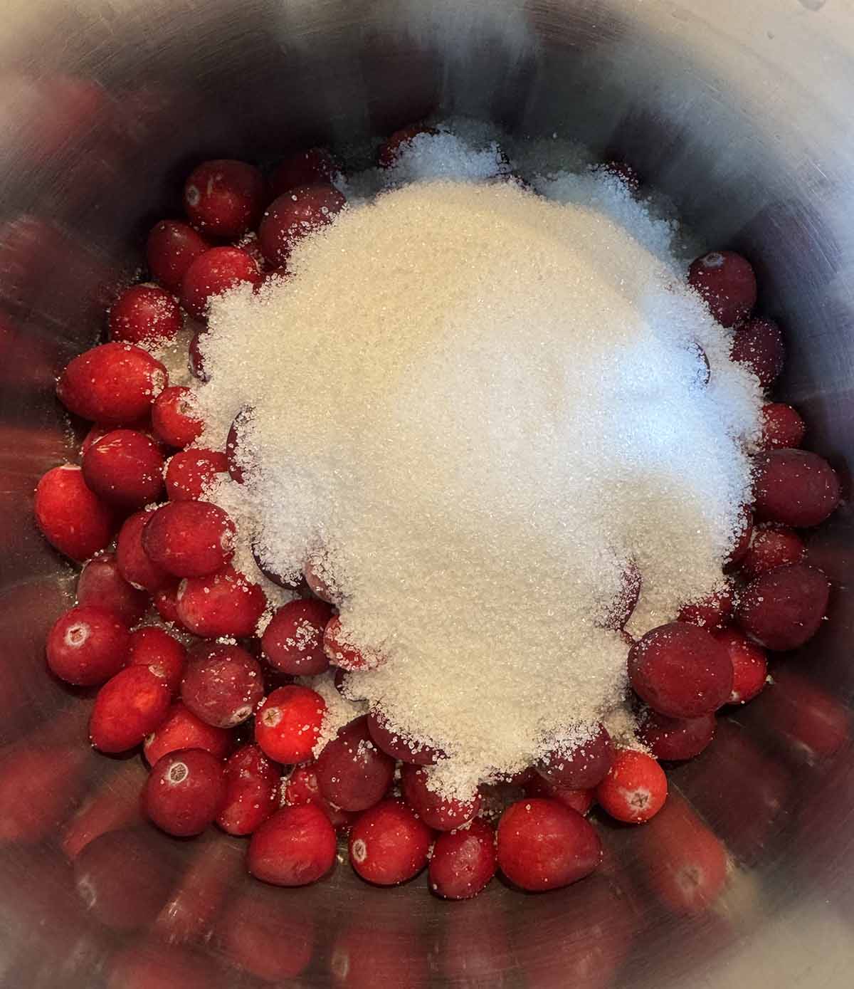 cranberries and sugar in a pot