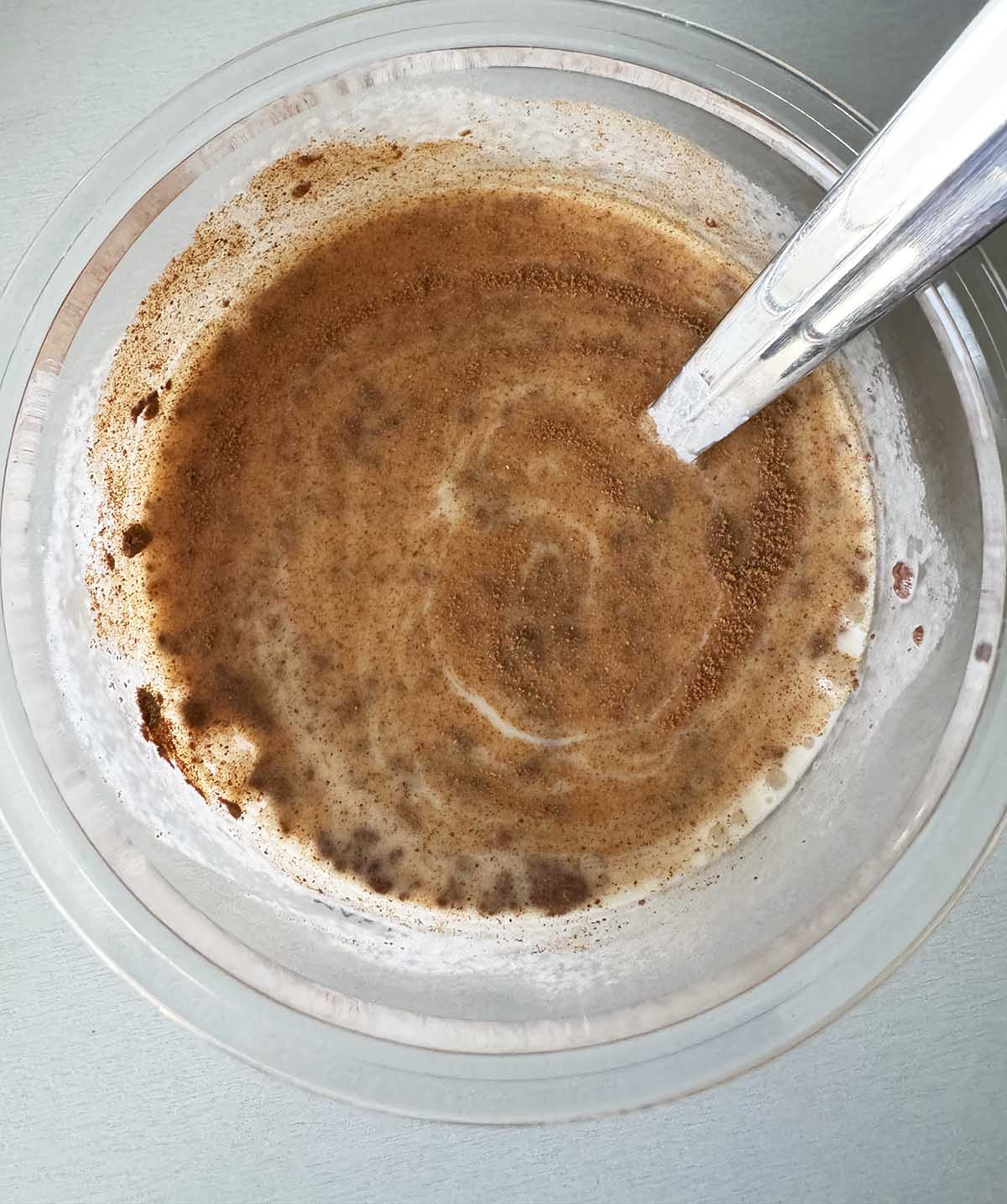 Mixing together ingredients for apple cinnamon creami