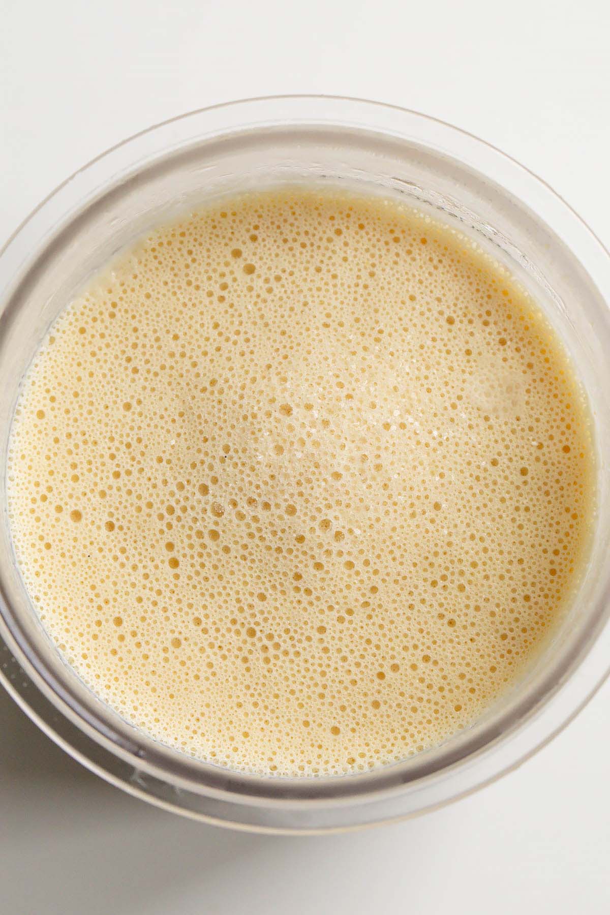 Frozen peanut butter ice cream in Creami container