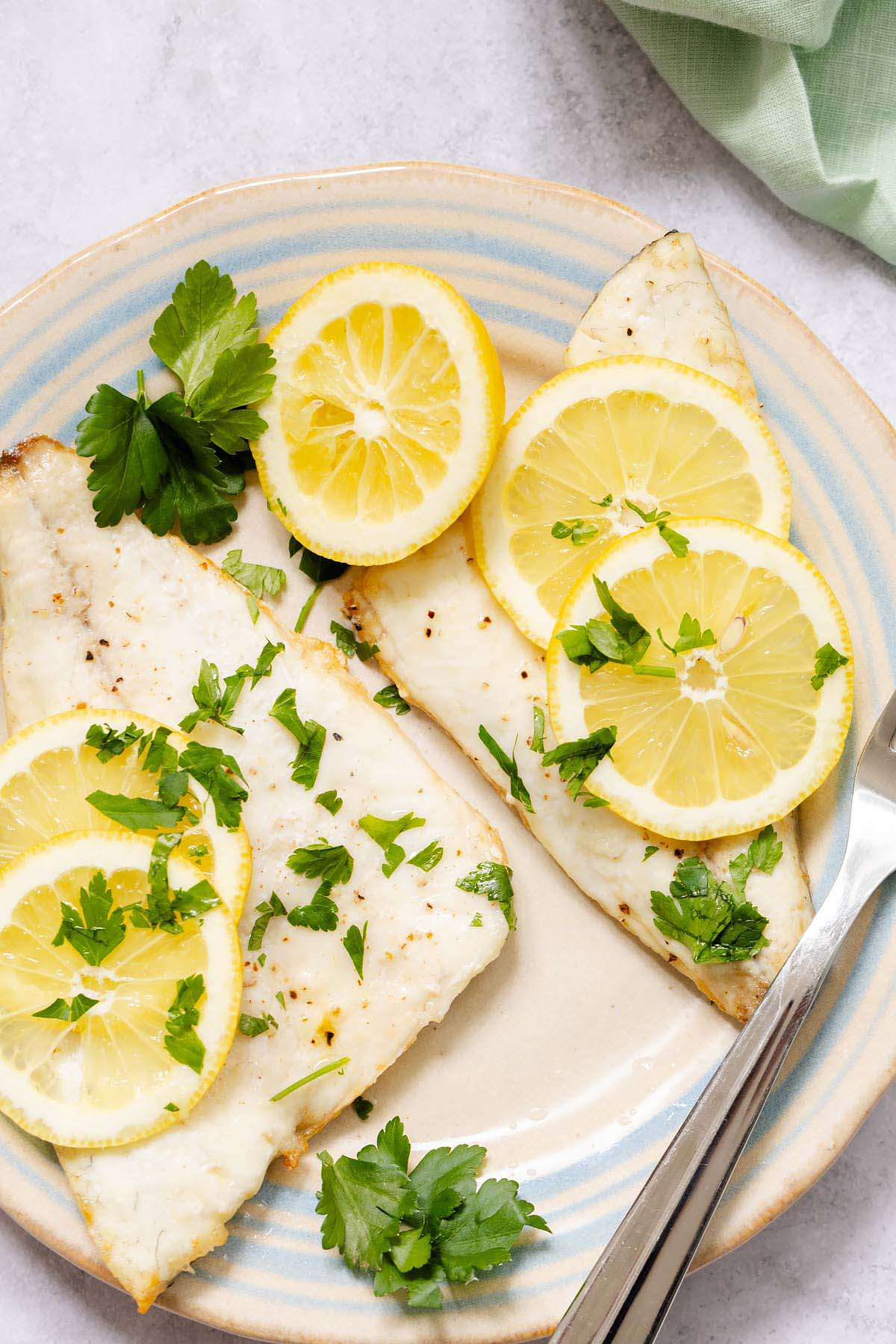 Air fryer sea bream fillets with lemon and parsley