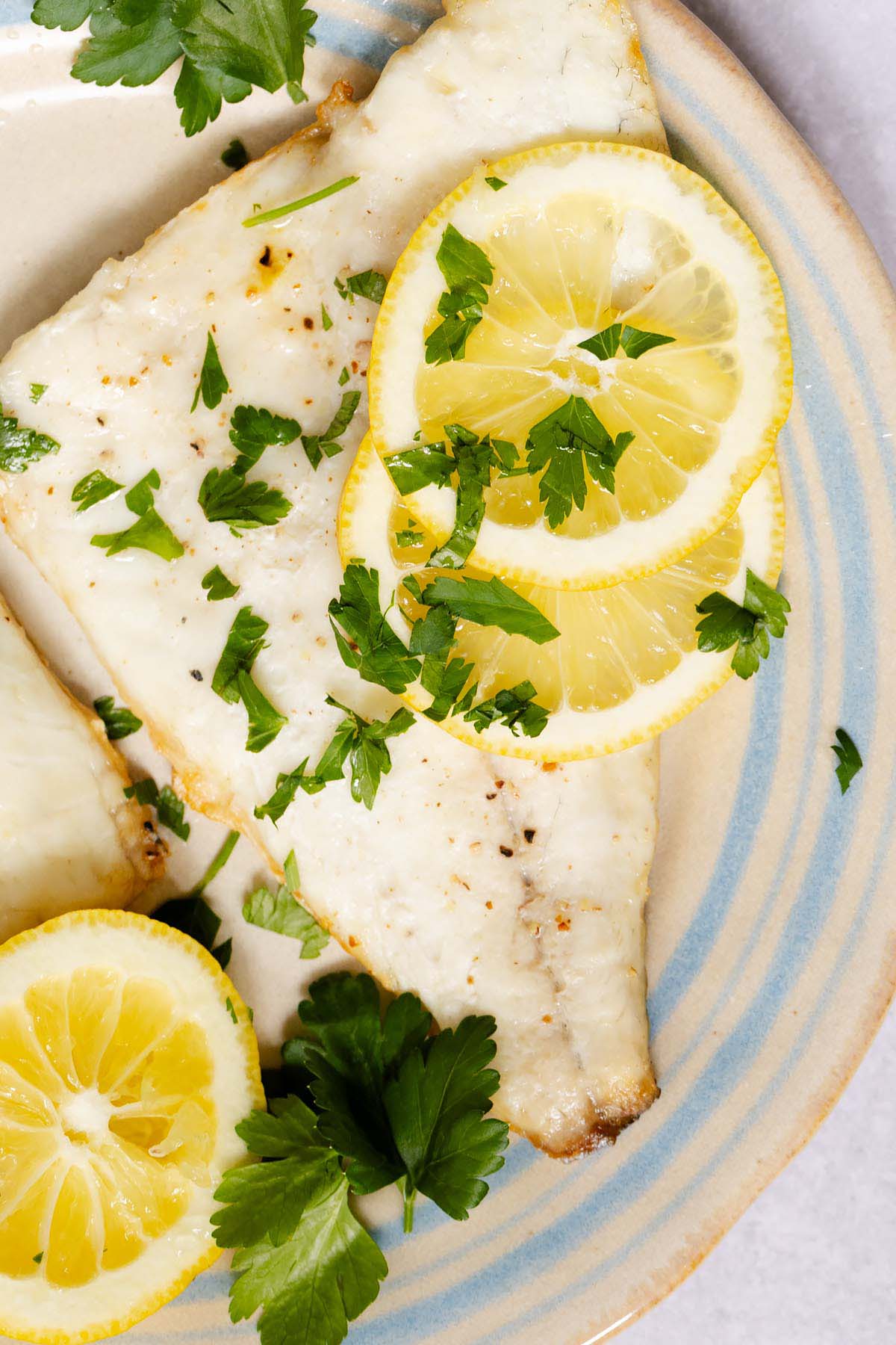 Air fryer sea bream fillets with lemon and parsley