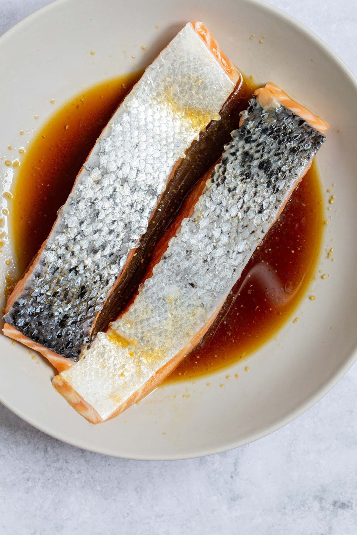 Salmon fillets marinating