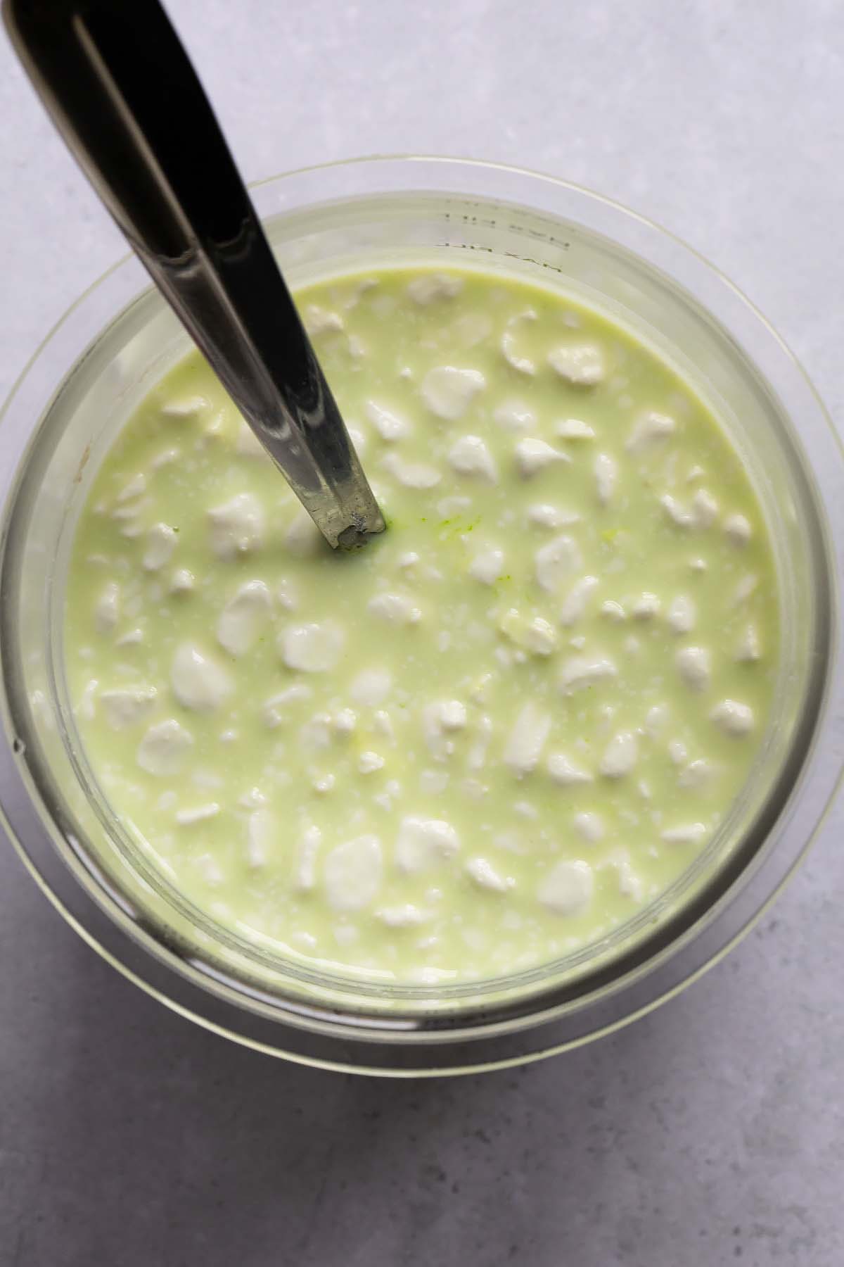 Ice cream ingredients mixed together for shamrock shake
