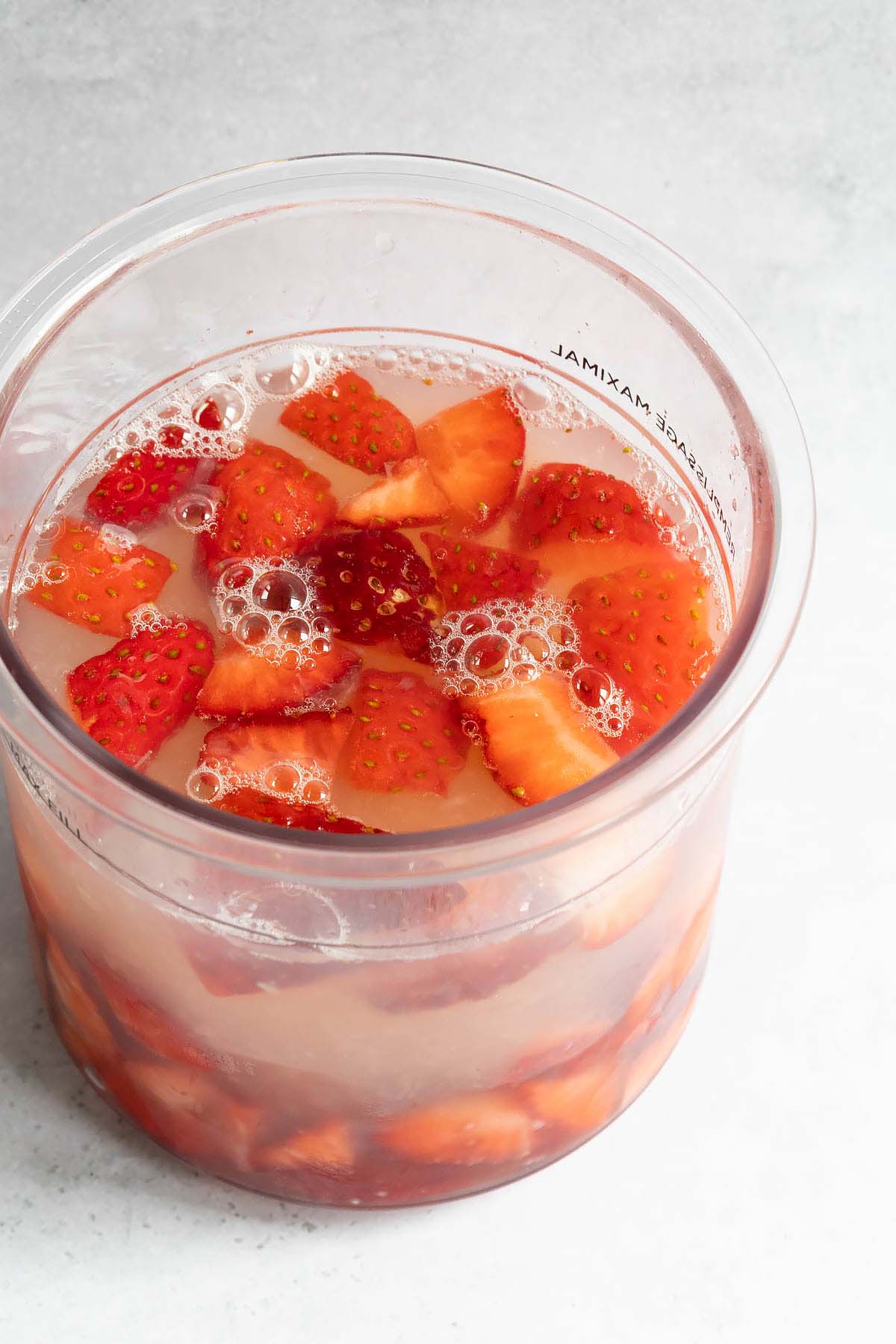 Strawberries and lemonade in Ninja Creami container