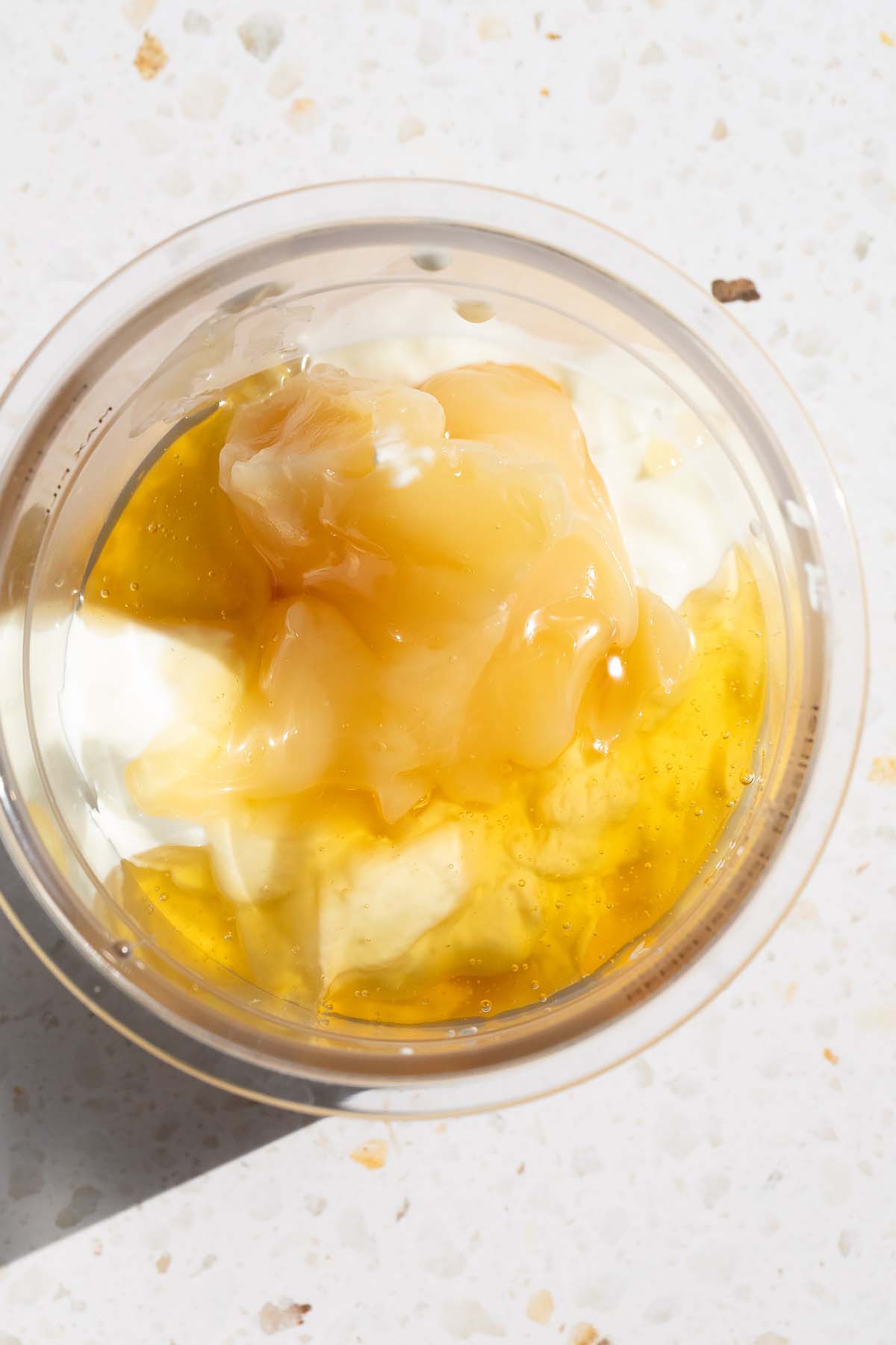 Lemon curd, honey, and sugar in Ninja Creami container