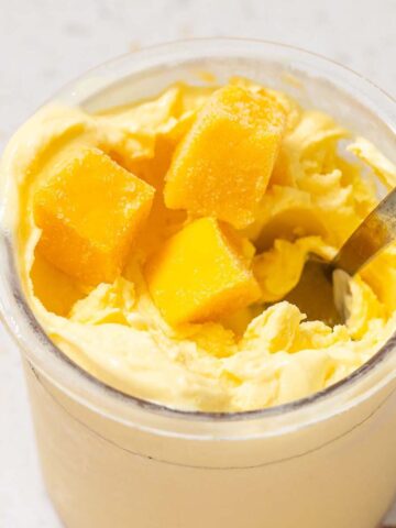 Ninja Creami mango frozen yogurt with mango pieces on top
