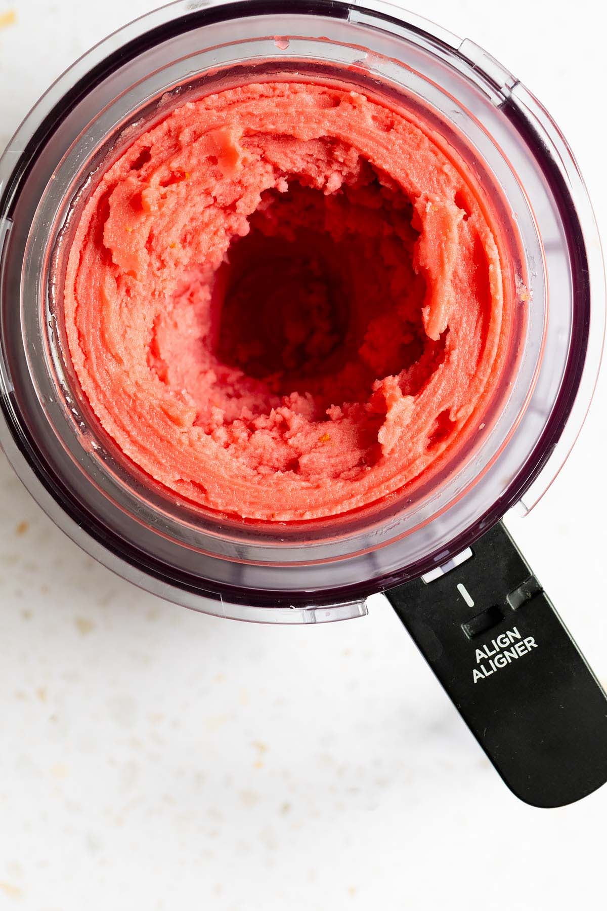 Processed hibiscus sorbet in Ninja Creami container
