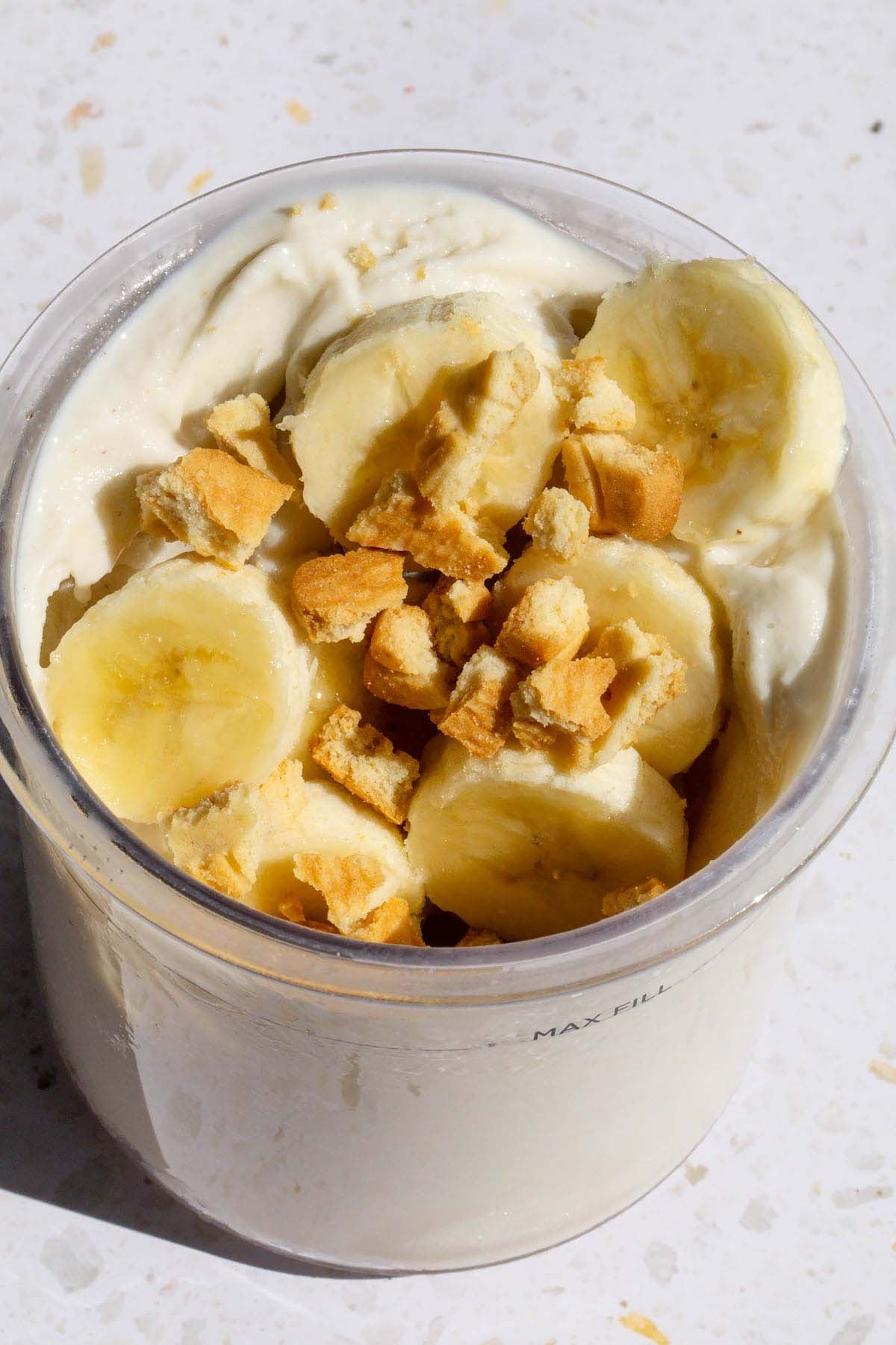 Adding bananas and cookies to banoffee ice cream