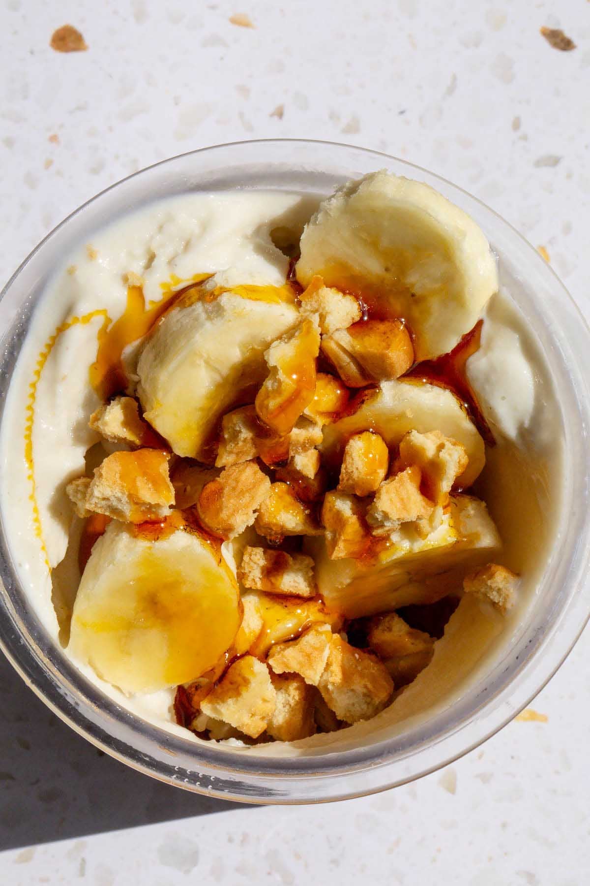 Adding caramel sauce to banoffee ice cream