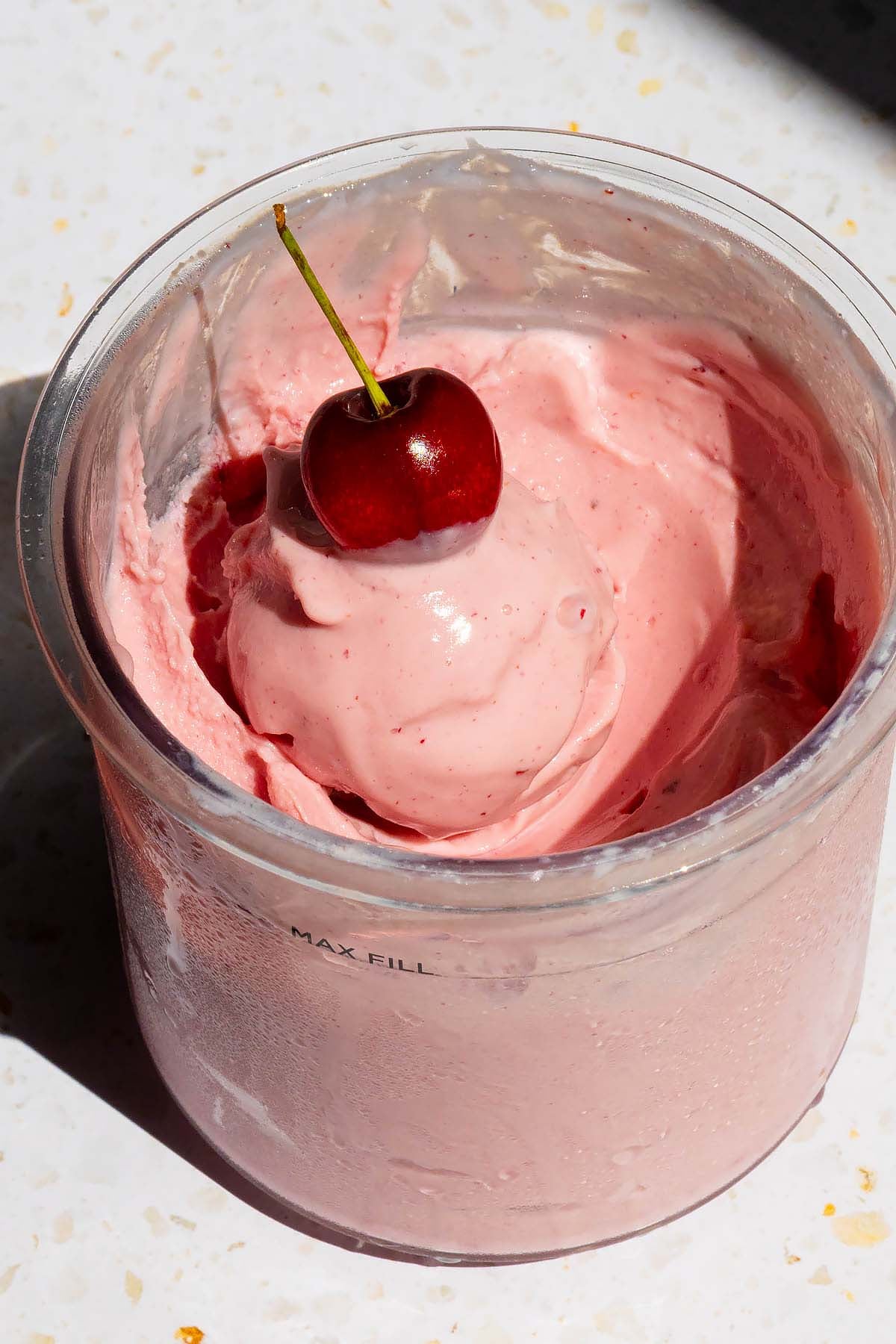 Ninja Creami cherry ice cream with a cherry on top