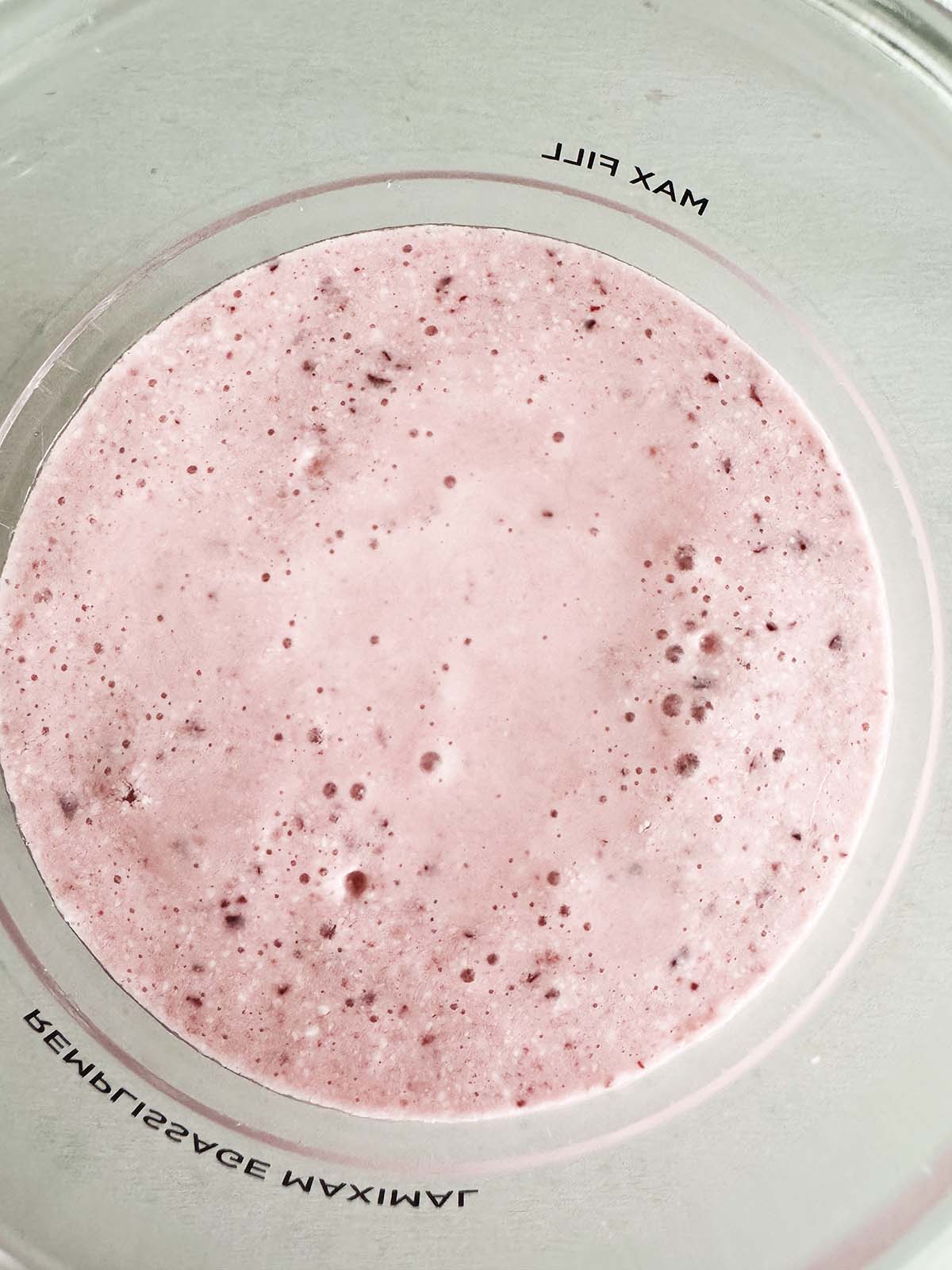 Unfrozen ice cream in Ninja Creami container