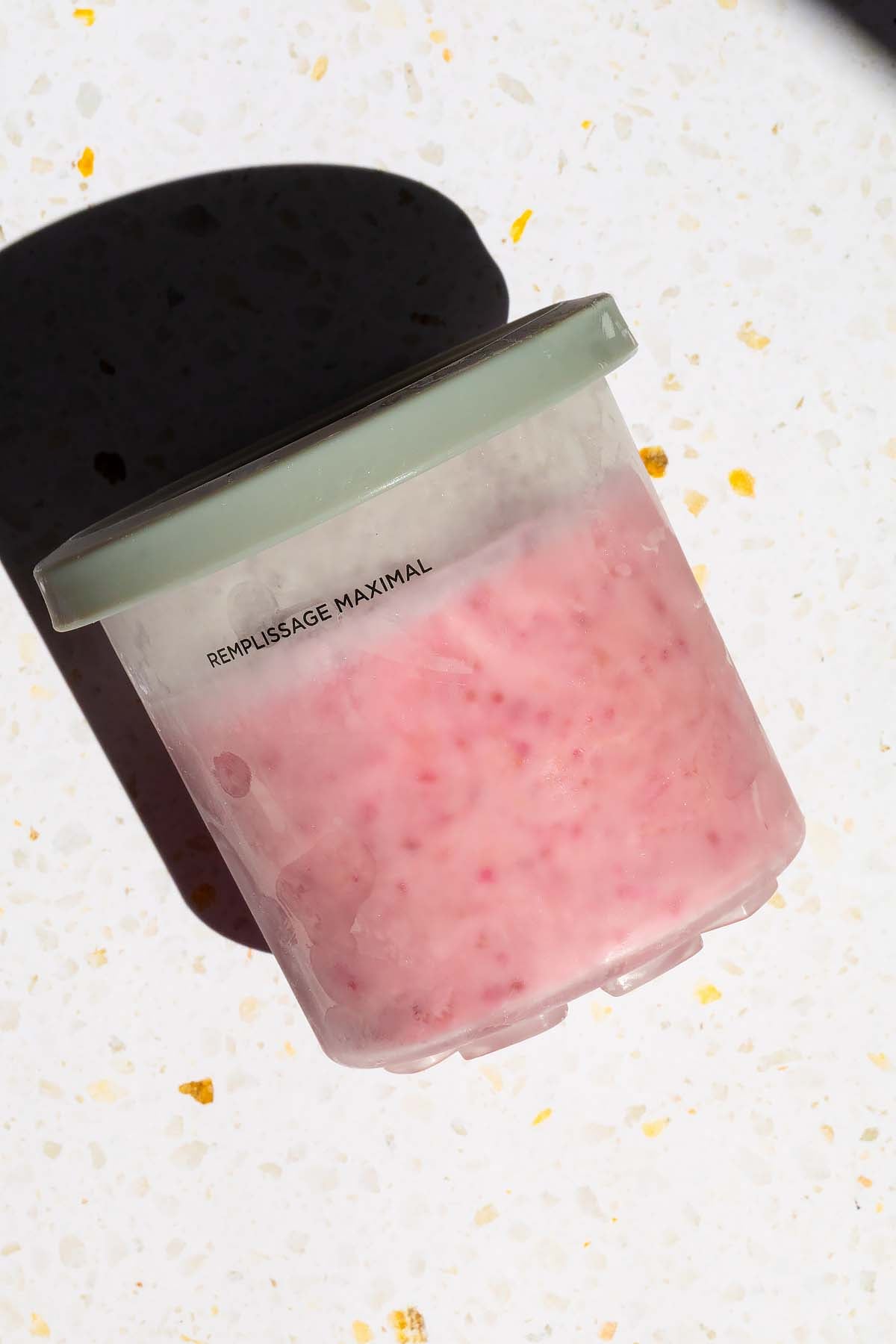 Frozen ice cream in Ninja Creami container