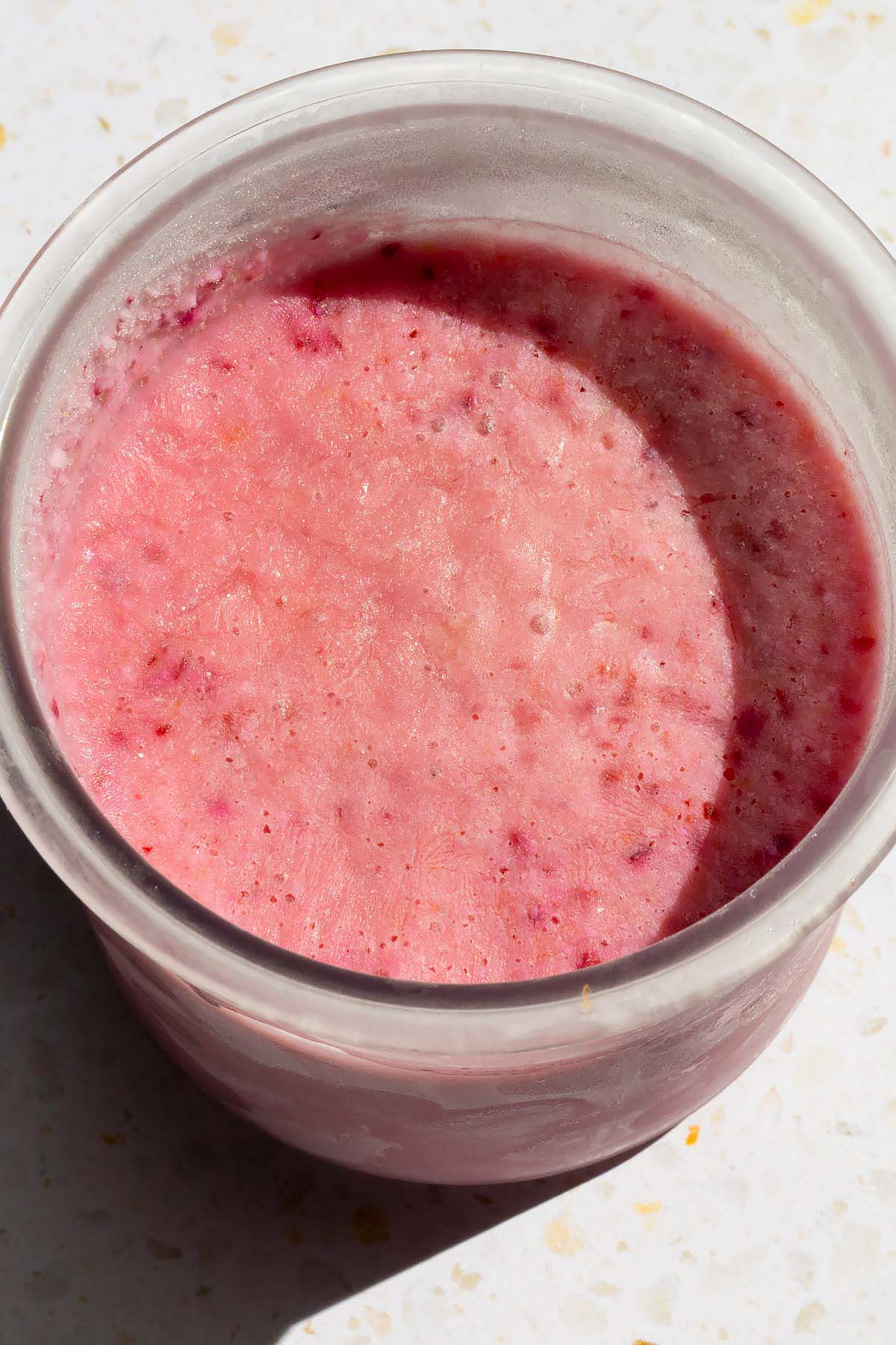 Frozen ice cream in Ninja Creami container