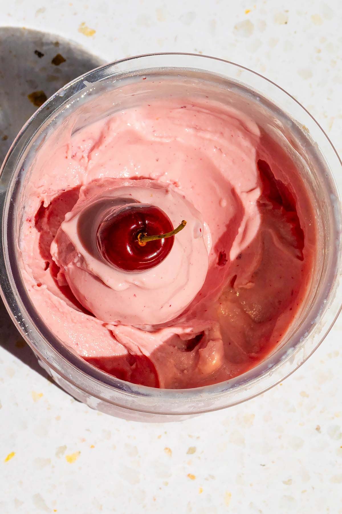 Ninja Creami cherry ice cream with a cherry on top