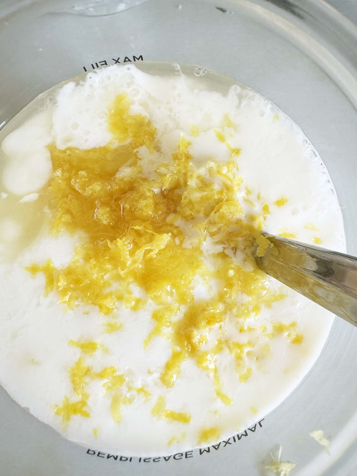Adding lemon zest to mixture
