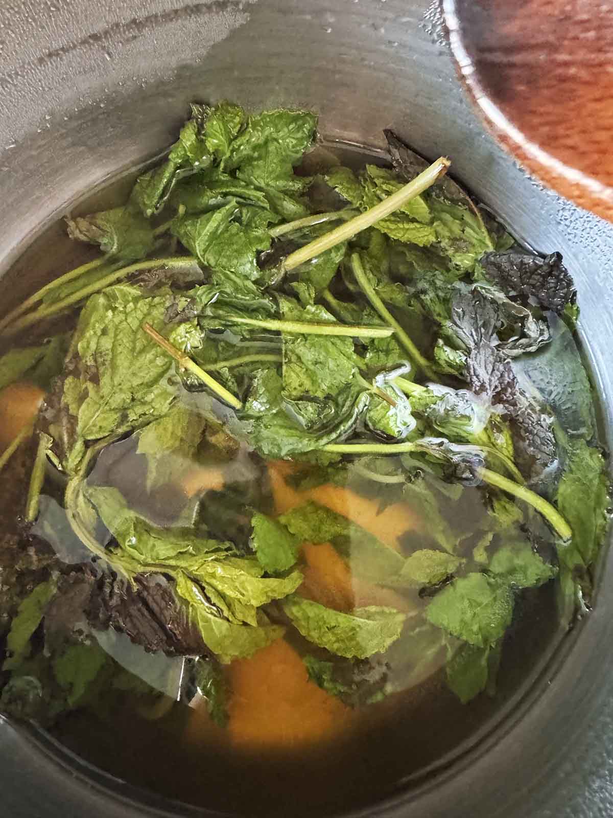 Steeping mint in tea