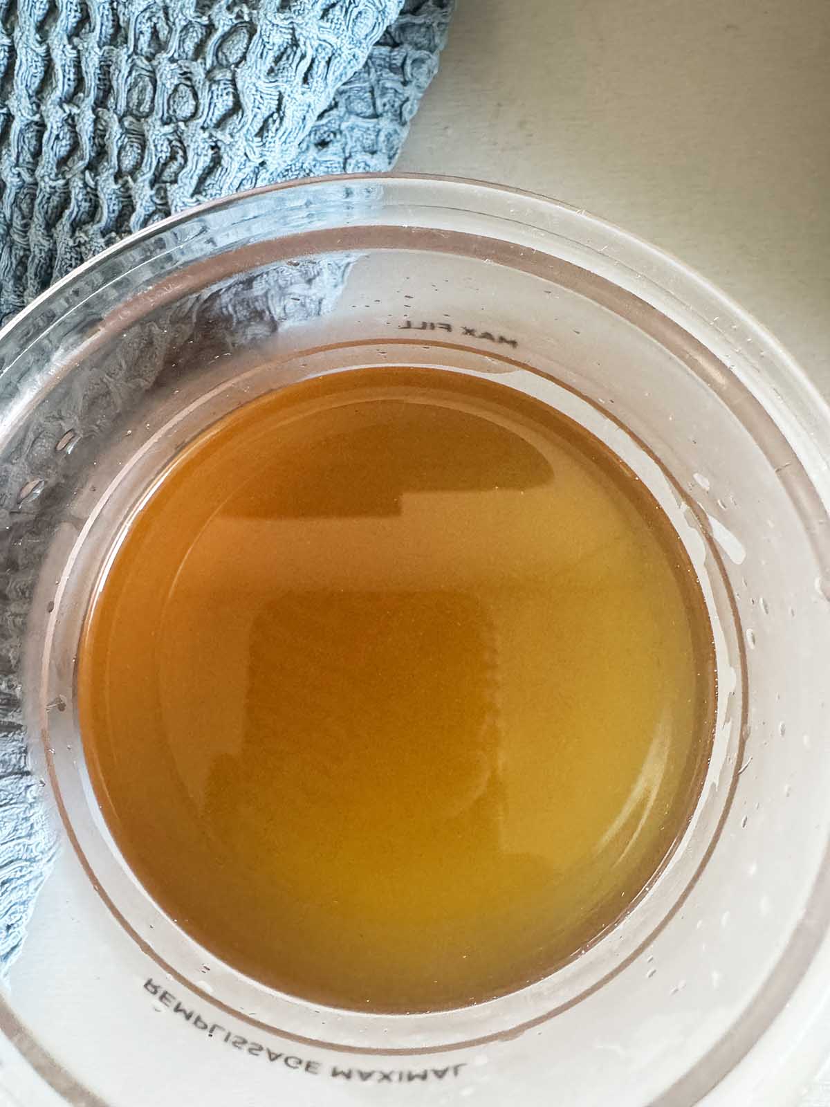 Strained mint tea in Ninja Creami container