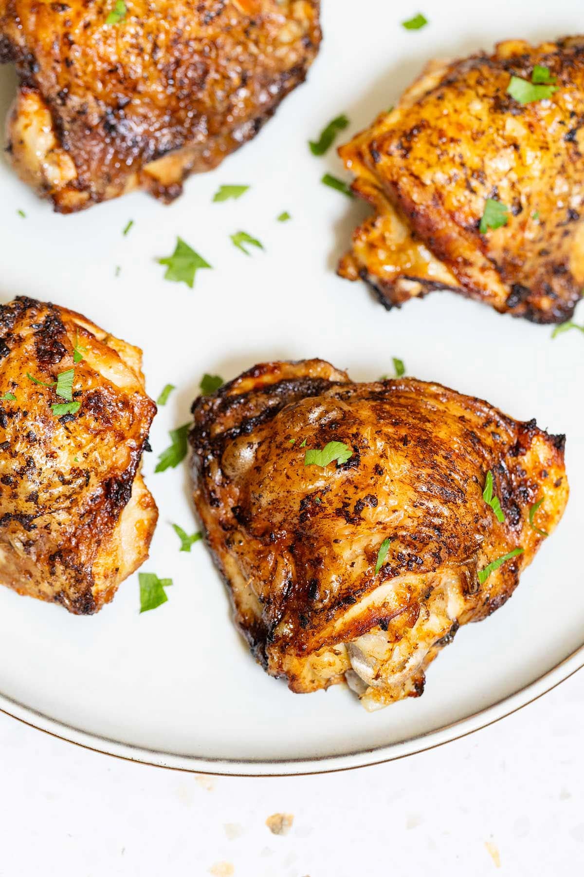Ninja Crispi chicken thighs on a plate