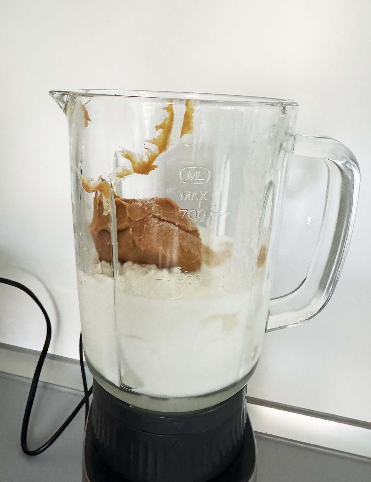 Mixing together peanut butter ice cream ingredients in a blender
