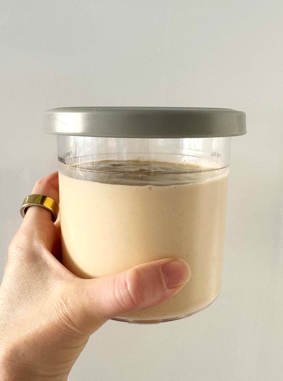 Unfrozen ice cream in Ninja Creami container