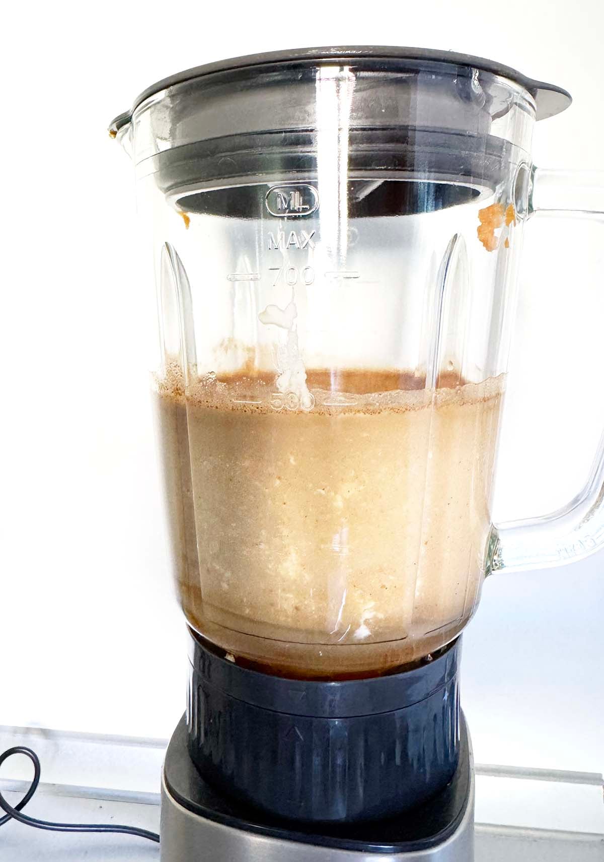 Blending together ingredients for pumpkin spice latte ice cream